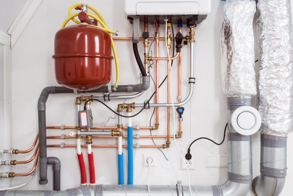 Heating installation and central boiler heating system on wall in house close-up