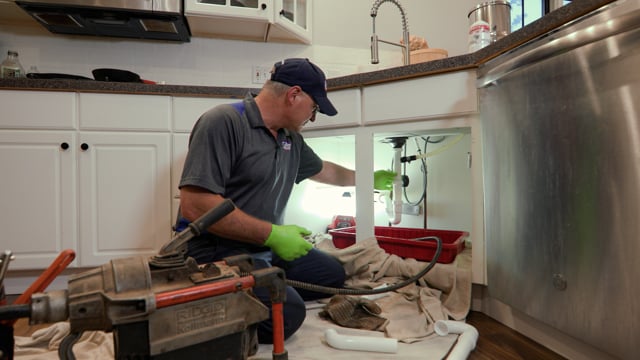 Cellino technician fixing a clogged kitchen drain