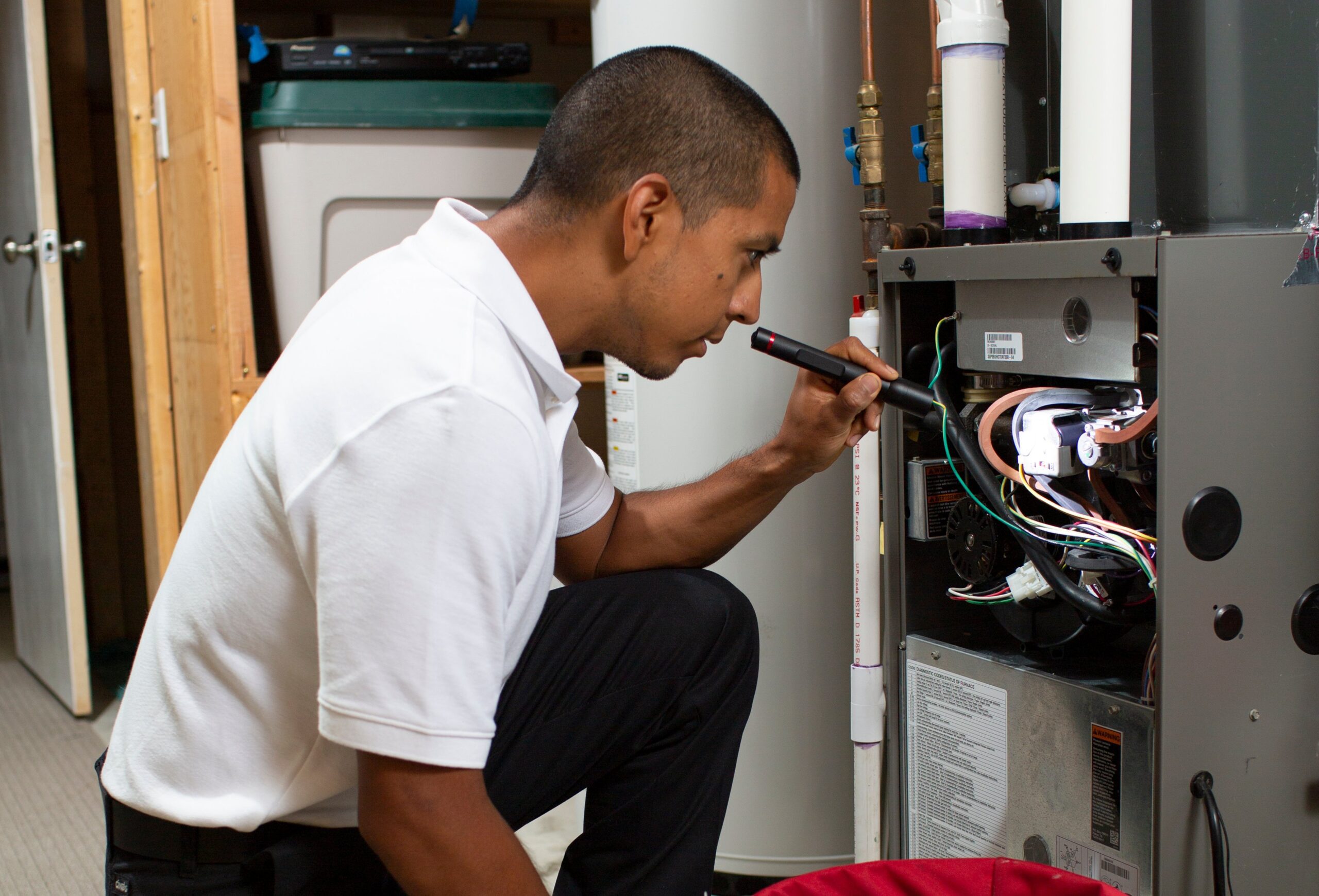 Cellino technician performing furnace services in Buffalo