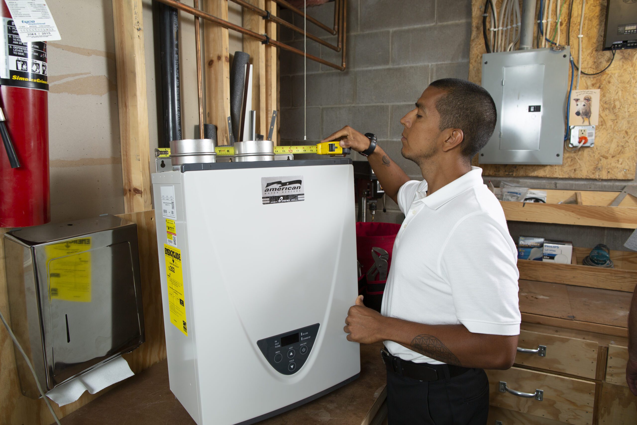 Cellino technician repairing a tankless water heater in Buffalo