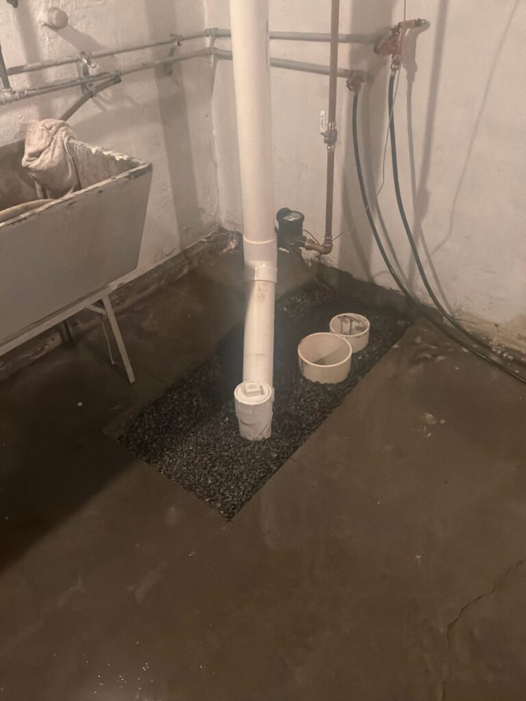 Concrete cut and broken up to access underground sewer and water lines during repair project by Cellino in Cheektowaga, NY.